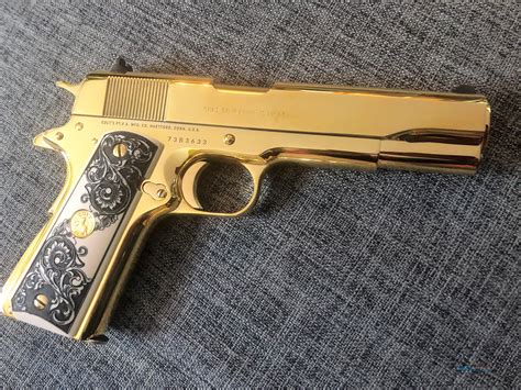 A 1911 pistol with gold plating