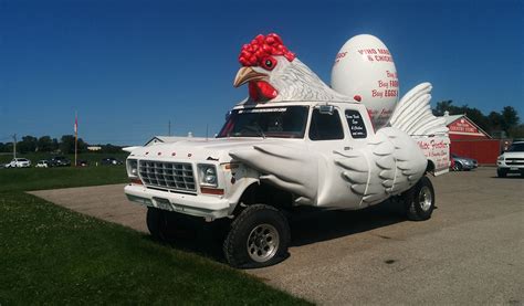 A 1960s chicken feed truck on a rural road