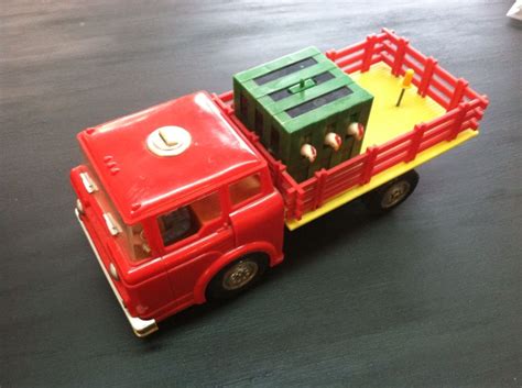 A restored 1960s chicken feed truck in a museum