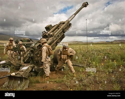 Marines from 1st Battalion, 12th Marines, conduct artillery fire