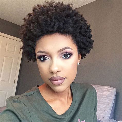 A young woman with 4c hair styled in an updo, paired with Air Force Ones