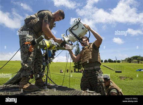 Marines from the 7th Communication Battalion performing radio and antenna maintenance during a training event.