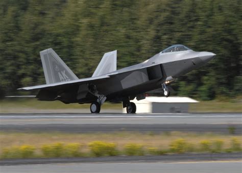 F-22 taking off in snowy conditions