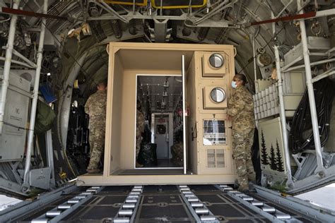 C-130 medical evacuation, with medical personnel tending to wounded patients