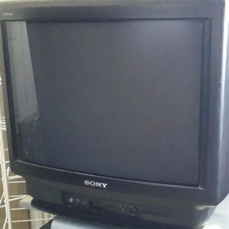 A vintage TV set playing a color broadcast