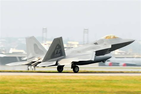 F-22 Raptor landing, showcasing its advanced aerodynamics