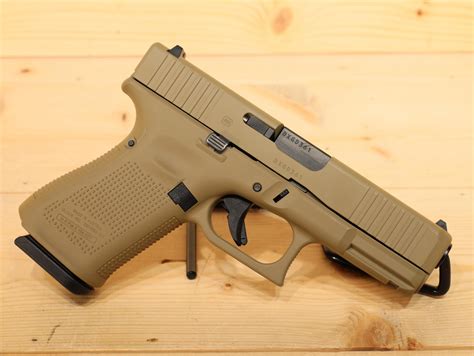 Glock 19 pistol being held by a concealed carry enthusiast