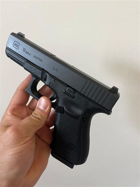 Glock pistol being held by a shooter