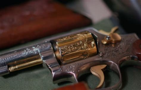 A collection of luxury handguns on display