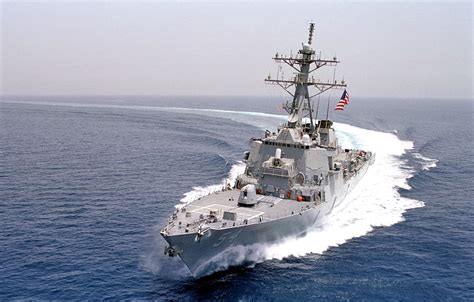 A photograph of a naval warship sailing through the ocean