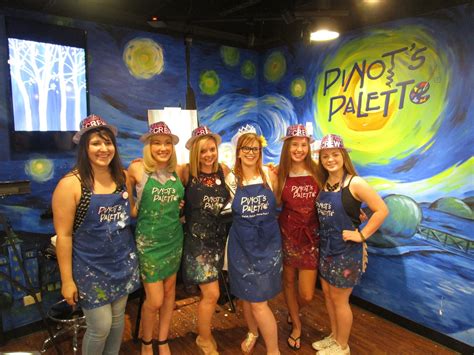 Group of friends painting at Pinot's Palette