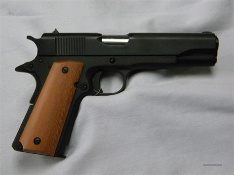 Rock Island M1911 pistol with engravings