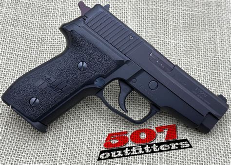 Sig Sauer P228 pistol with a 13-round magazine