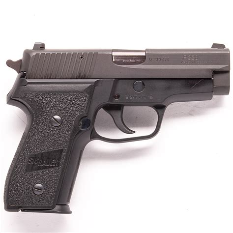 Sig Sauer P228 pistol with a price tag