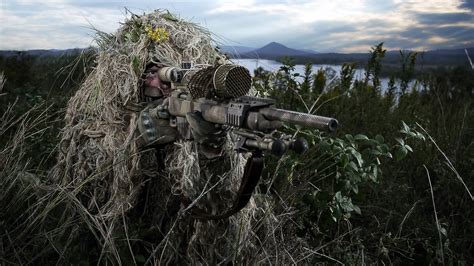 Sniper in camouflage gear