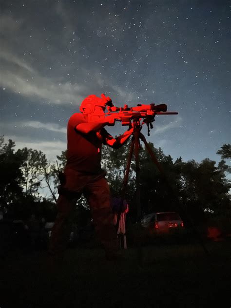 Sniper using night vision equipment