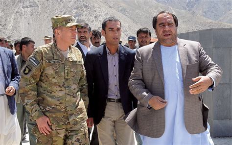 An Afghan interpreter with a US soldier in a meeting