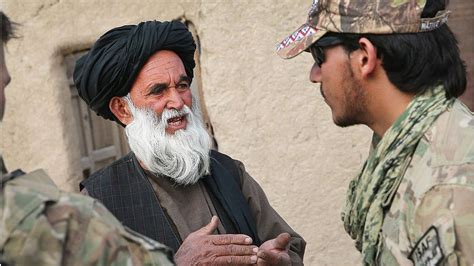 An Afghan interpreter providing cultural advice to US troops