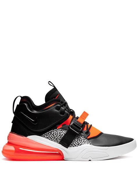 Air Force 270 sneakers with bold, graphic-print pants and a trendy hat