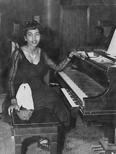 Alberta Adams teaching music students