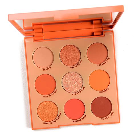 A vibrant orange eye shadow palette with 14 shades