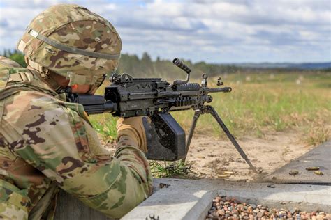 An Army machine gunner in action