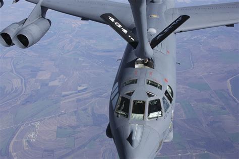 B-52 Stratofortress refueling from a tanker aircraft, with fuel hose extended