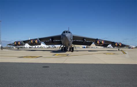 B-52 Stratofortress performing at an airshow, with smoke and flames visible