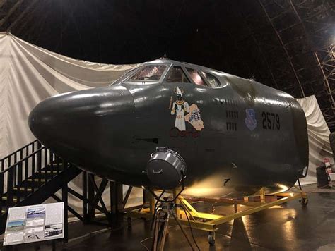 B-52 Stratofortress on display at a museum, with visitors viewing the aircraft