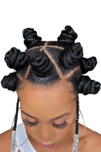 A young woman with 4c hair styled in Bantu knots, paired with Air Force Ones