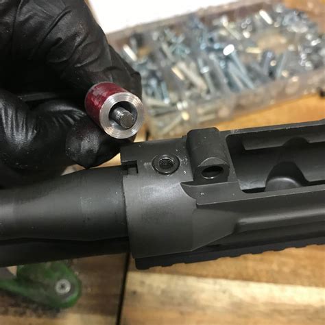 Removing the barrel from a rifle