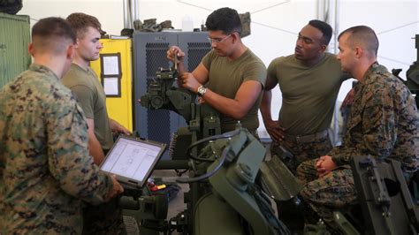 A Marine gunner operating an artillery system