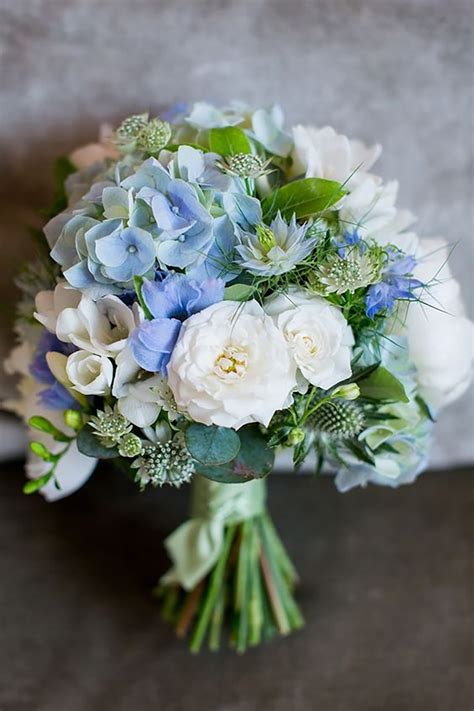 Blue wedding flowers with white and green accents