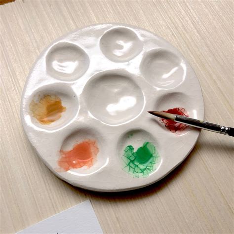 Ceramic palette with paints