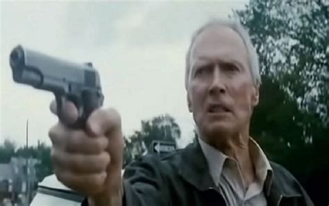 Clint Eastwood shooting a revolver