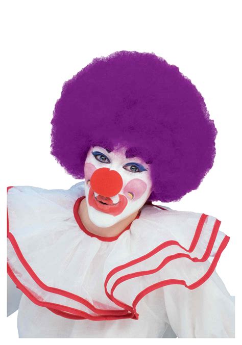 A clown holding a purple umbrella