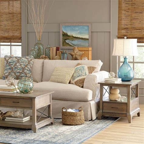 Coastal living room with off-white and gold nautical accents