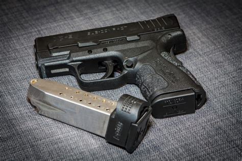 Concealed carry handguns with extended magazines