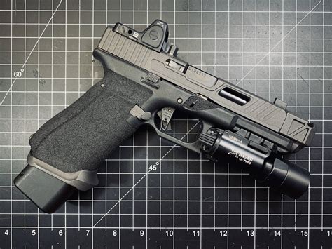 Glock 17 with a compensator installed