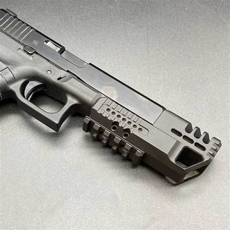 Glock 17 with a compensator and muzzle brake installed