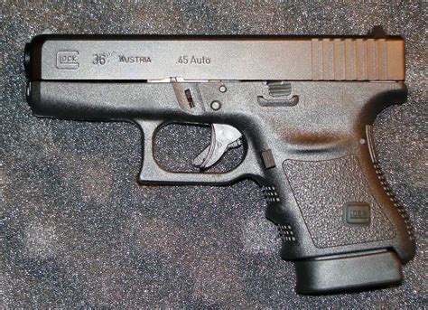 A Glock handgun with a holster