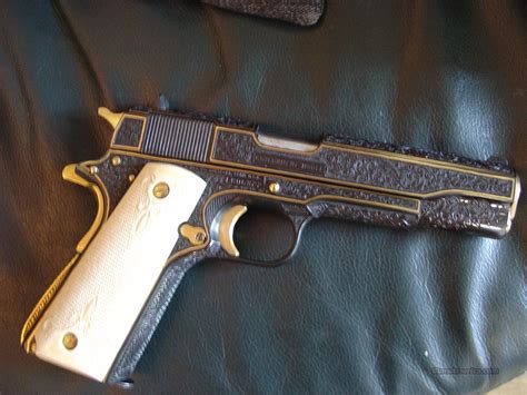 A 1911 pistol with gold inlays