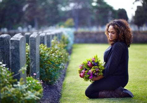 Visiting a grave to pay respects