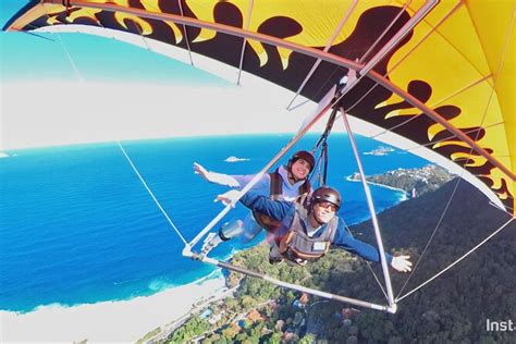 Hang gliding over a forest