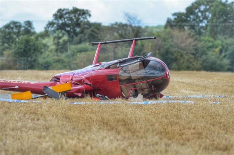 A helicopter crashing to the ground, with smoke and flames erupting