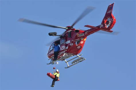 A helicopter responding to an emergency situation, with flashing lights and sirens