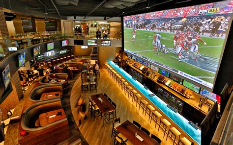 A massive TV installed in a sports bar