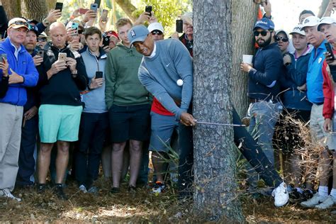 Golfer using a hybrid golf club for a recovery shot