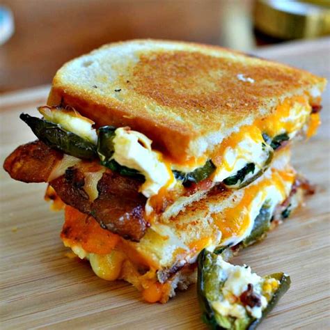 A spicy grilled cheese sandwich filled with jalapeno poppers