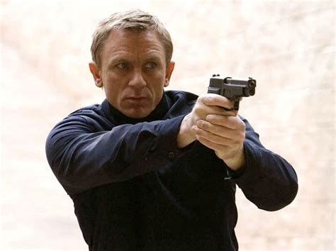 Daniel Craig as James Bond with the SIG Sauer P226